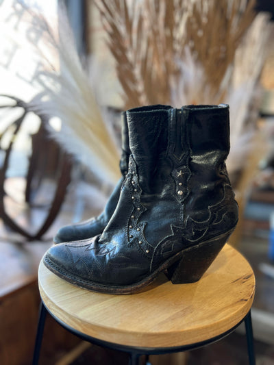 Side view of Liberty Black Booties in size 8.5 showing the unique leather overlay.