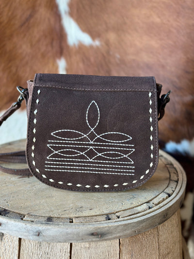 Compact and Stylish Brown Suede Crossbody Bag adorned with Bootstitch and whipstitch patterns for Everyday Wear and true Western Style.