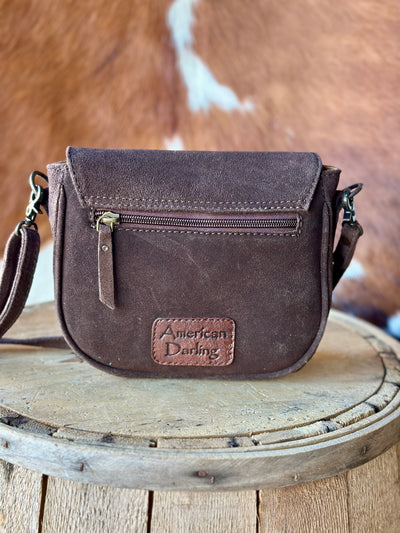 Western-inspired suede leather bag with boot stitch accents.