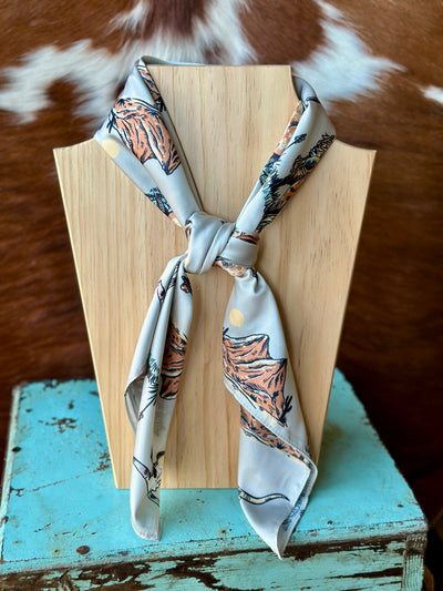 Soft and lightweight Sonny Longhorn Wild Rag with a vibrant cream, black, and burnt orange color scheme, ideal for any Western wardrobe.