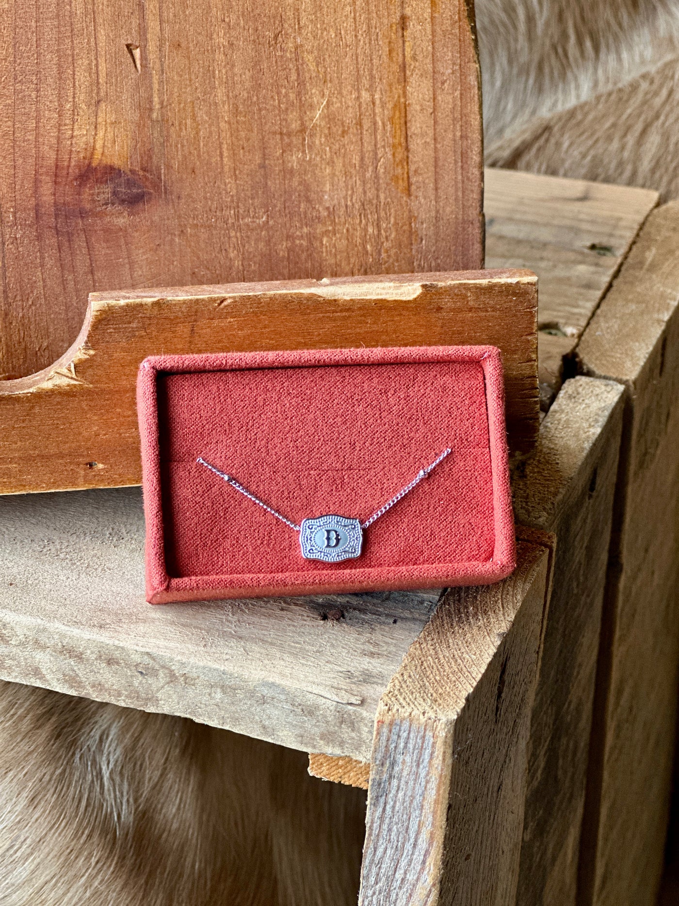 Delicate silver necklace with ultra mini belt buckle and personalized initial