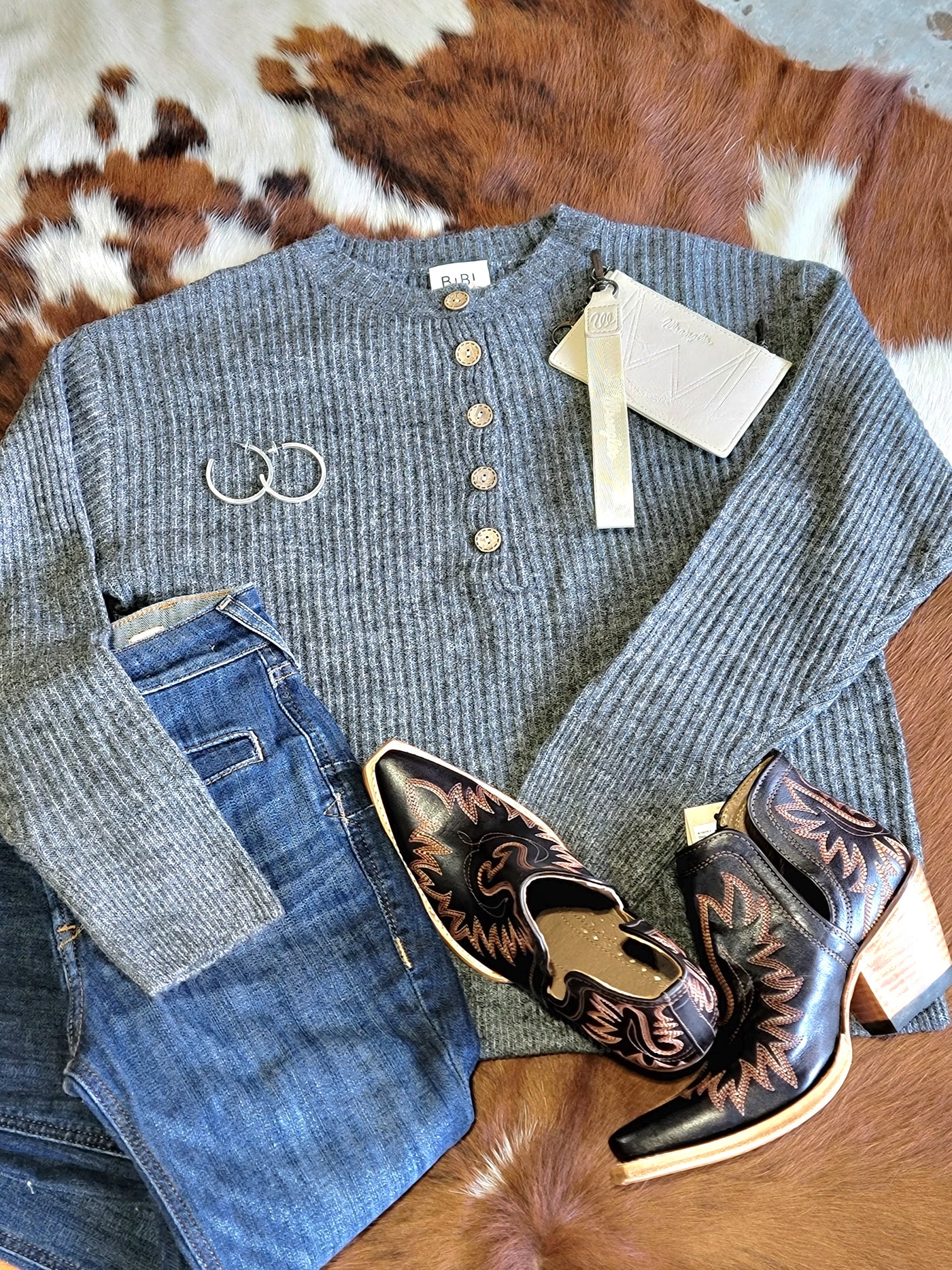 Flat lay outfit at Broker Leather inspired casual look with Ariat Dixon booties and hoop earrings.