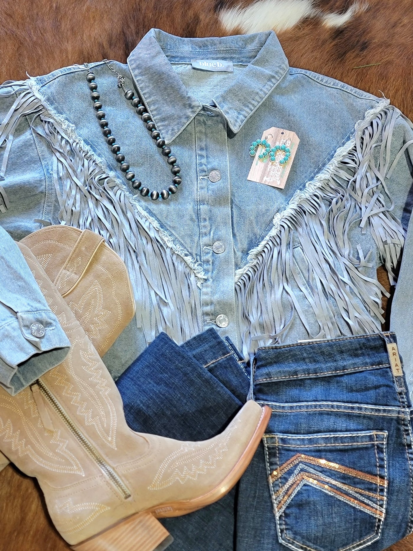 Outfit inspiration featuring the Tessa Fringe Denim Jacket, Navajo Pearls, Turquoise Squash Blossom Earrings, Ariat Jeans and Ariat Casanova Boots.