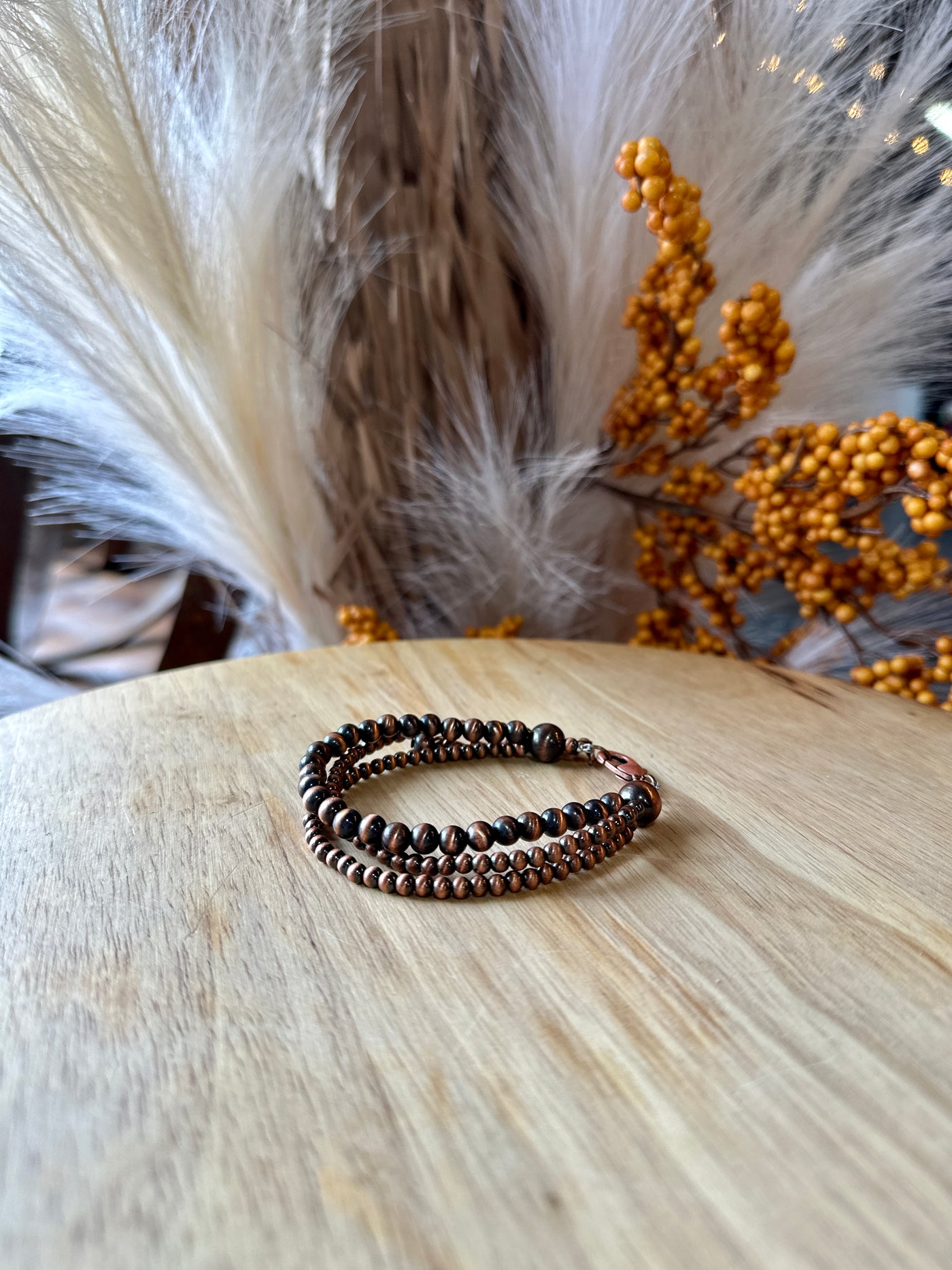 Theta Copper Faux Navajo Pearl Adjustable Bracelet showcasing its soft texture and casual elegance.