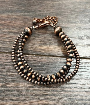 The Theta Copper Faux Navajo Pearl Adjustable Bracelet is the perfect cowgirl Christmas gift.