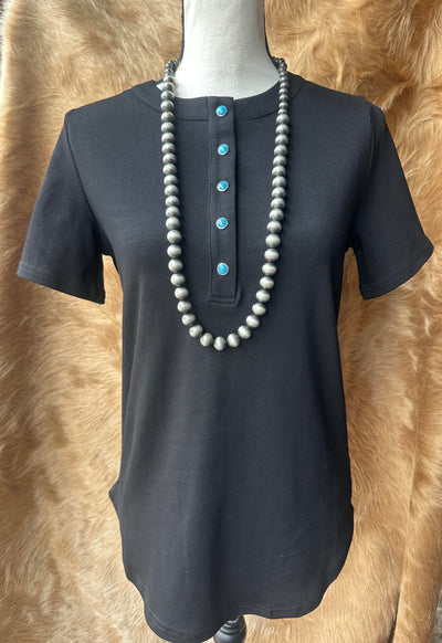Tilly Turquoise Pearl Snap Short Sleeve Shirt in black with turquoise snaps, front view