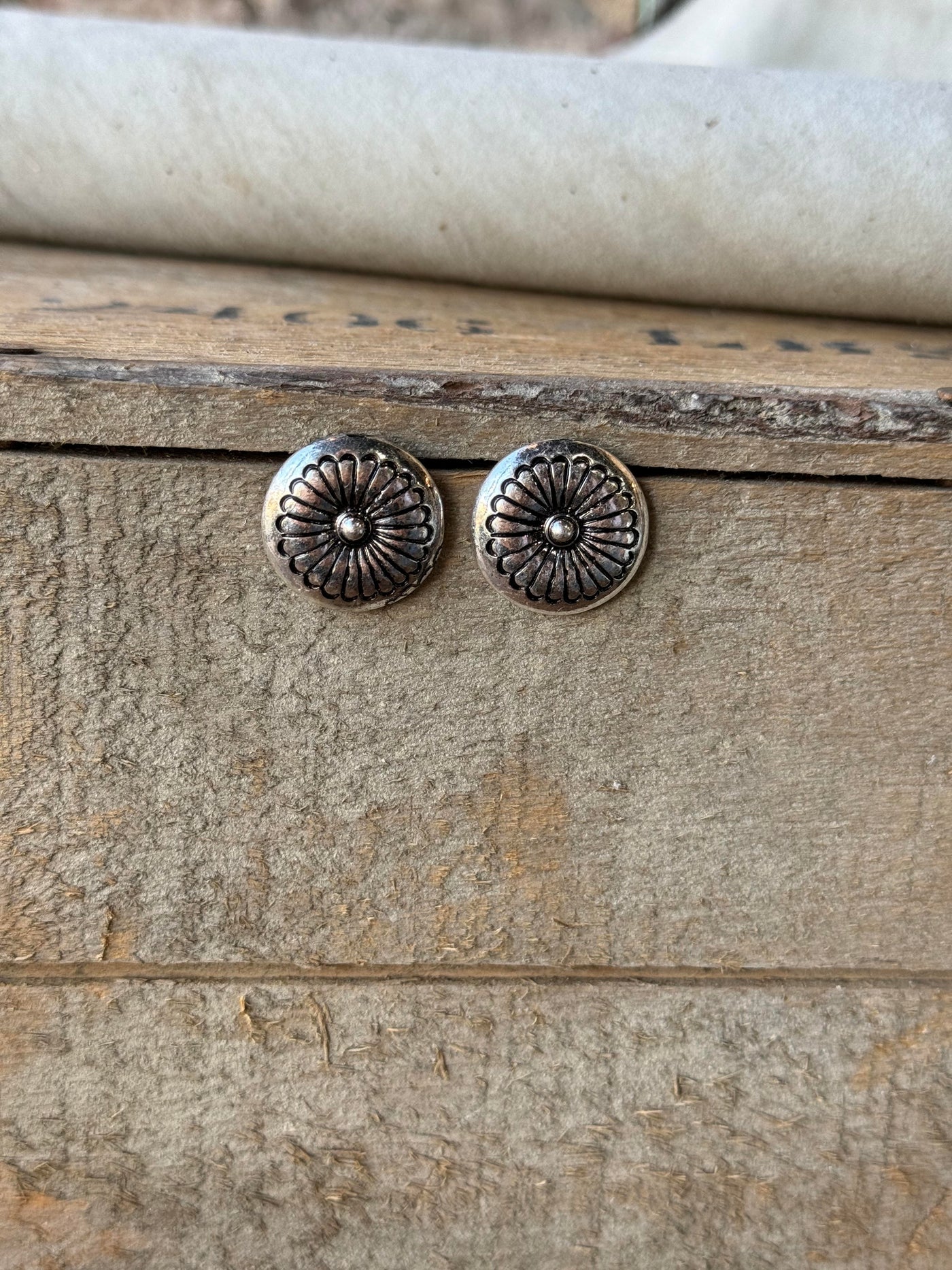 Toppling Silver Concho Earrings