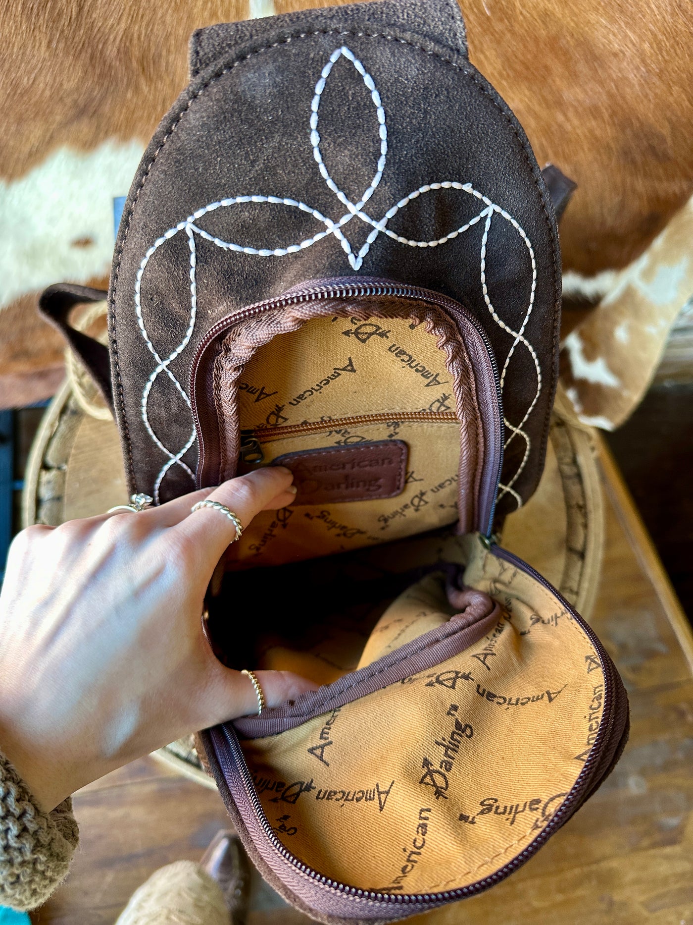 Inside View of Treaty Backpack Featuring Zippered Pocket and Lining.