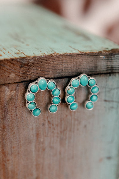 Fashion-forward Trisha Squash Post Back Earrings with faux turquoise stones in a Squash Blossom Naja Shape.