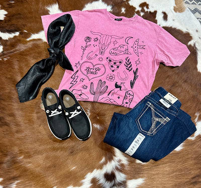 Western icons such as the bull skull, cowboy hat, cactus, rose, horseshoes and rope heart printed in black ink on a pink graphic tee.