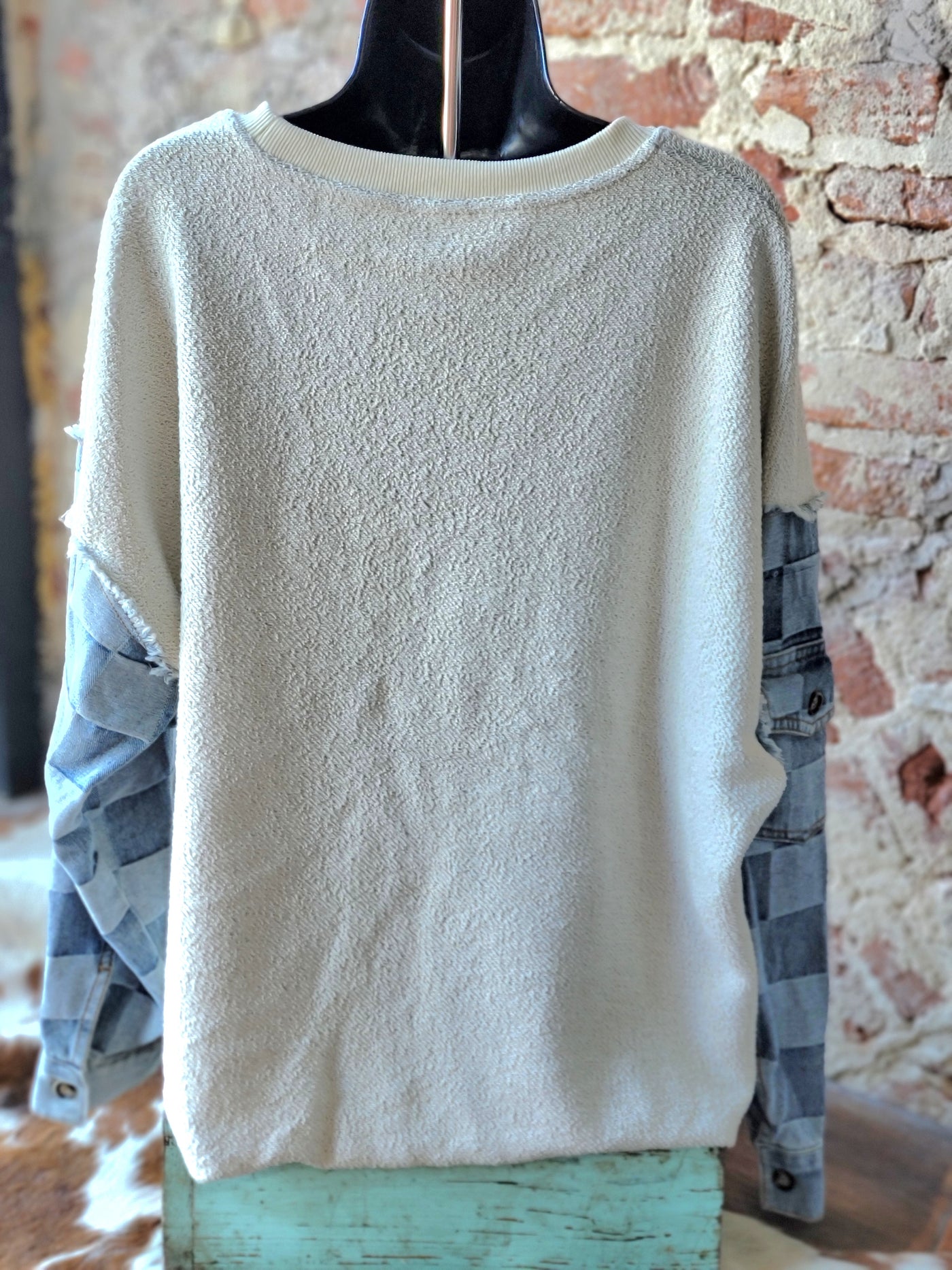 Rear view of our Victoria Terry & Denim Sleeve Pullover on a mannequin.