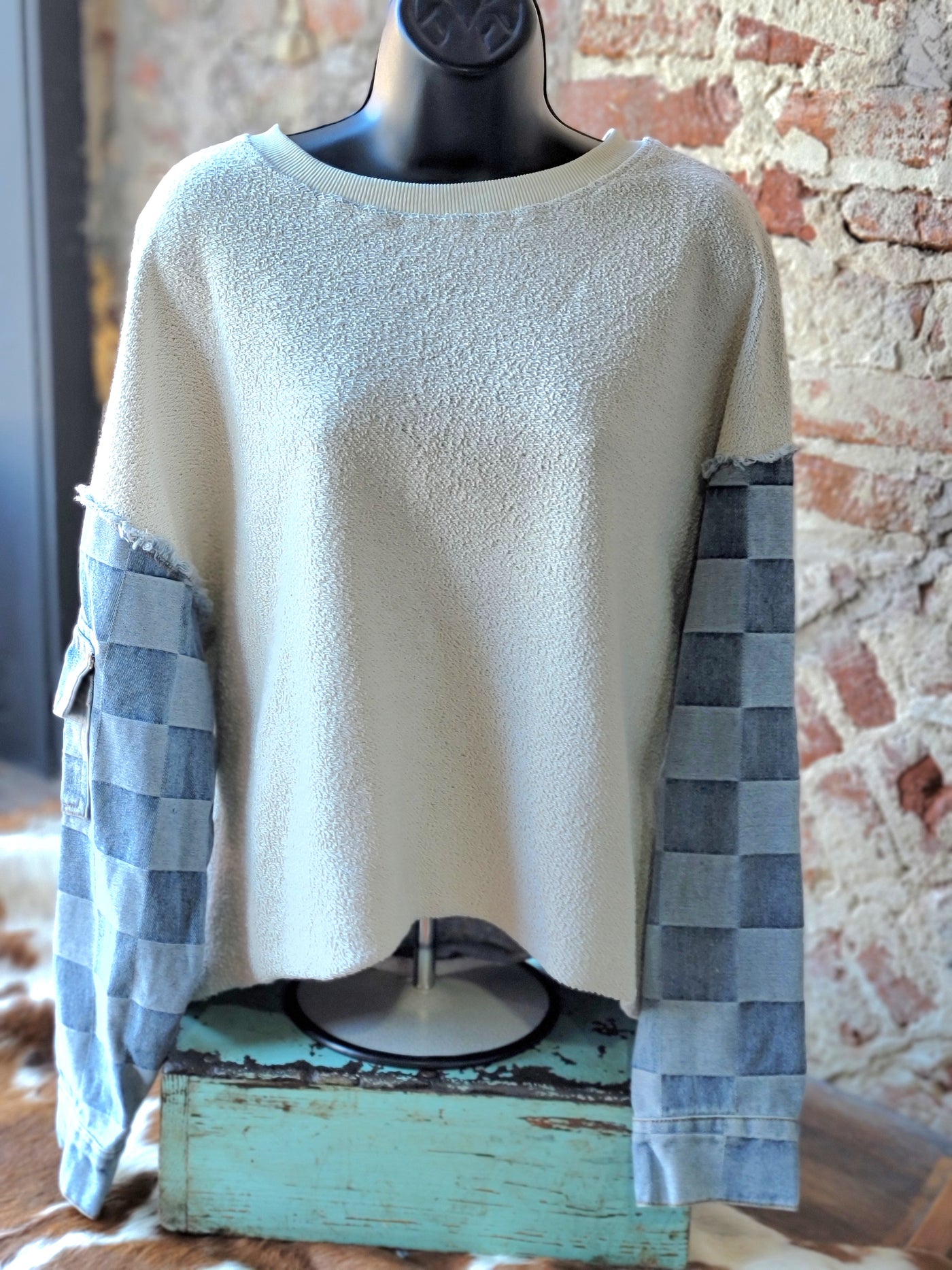 Front view of our Victoria Terry & Denim Sleeve Pullover on a mannequin.