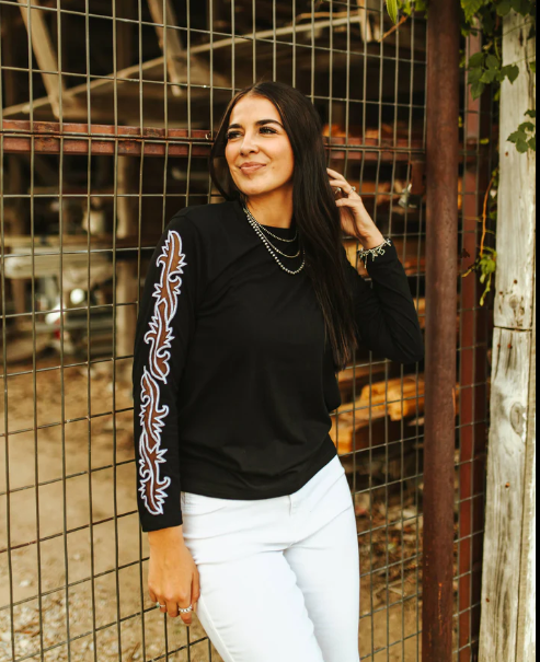 The Walton Boot Stitch Sleeve Top styled for a casual yet bold look, perfect for those who embrace their entrepreneurial spirit with courage.