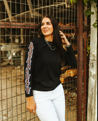 The Walton Boot Stitch Sleeve Top styled for a casual yet bold look, perfect for those who embrace their entrepreneurial spirit with courage.