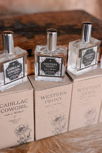 Stylish glass bottle of Western Peony Perfume Spray, ideal for the modern Western woman.