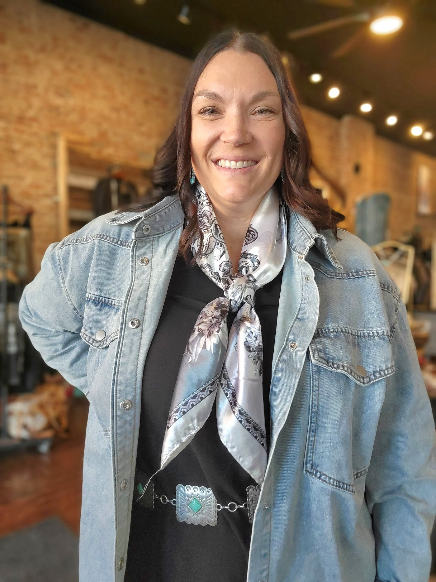 Woman modeling the Weston White & Silver Floral Wild Rag.