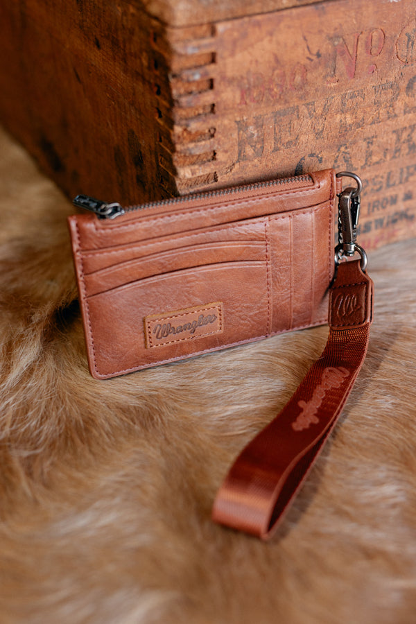 Compact brown wristlet wallet with zip-top closure, five credit card slots, and attached key ring.