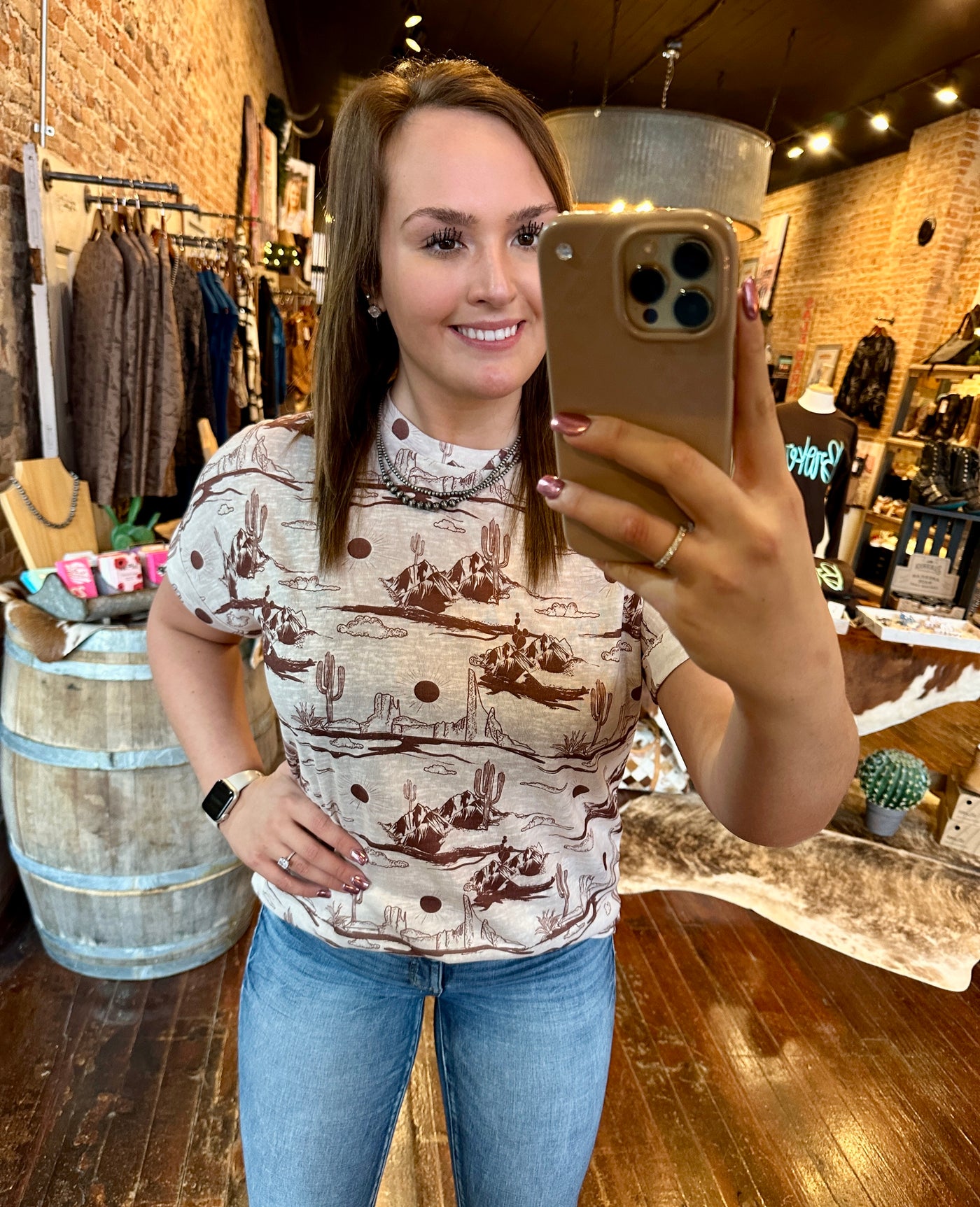 Wren Desert Scene Top modeled by Broker Leather employee showcasing casual look.