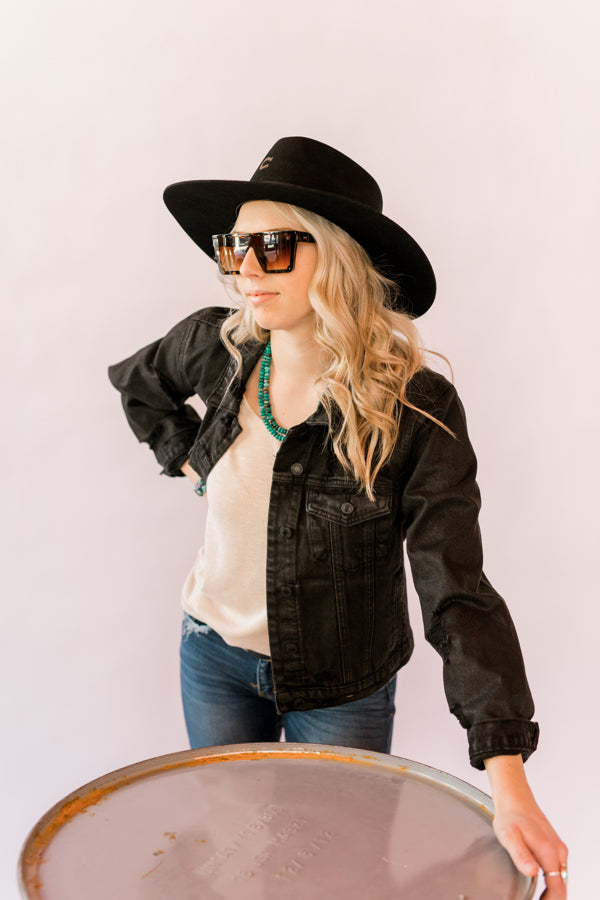 American Bonfire Co. Kerosene Sunglasses modeled by Broker Leather employee.