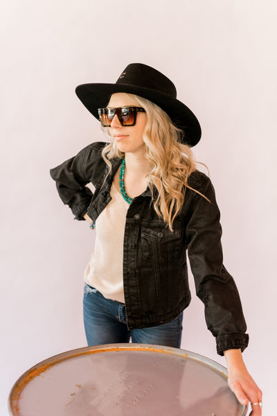 American Bonfire Co. Kerosene Sunglasses modeled by Broker Leather employee.