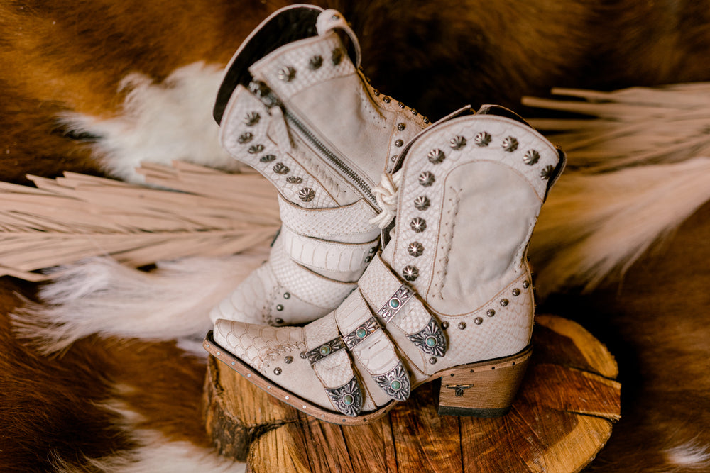 Incredibly detailed white leather Lane Showdown Boots with a 2.25-inch heel and 7.5-inch shaft height.