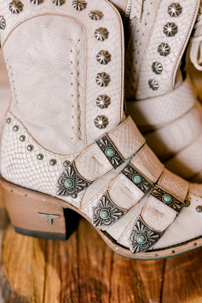 Close-up of Lane Showdown Buckled Boots showcasing the beautiful turquoise and silver buckle strap details.