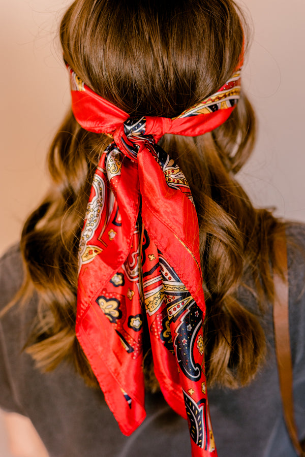 Rear view of woman modeling the Welsh Red Paisley Wild Rag as a headpiece.